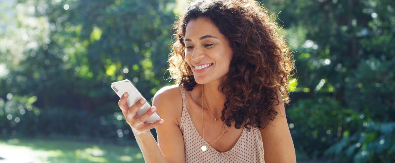 A woman using a smartphone outside